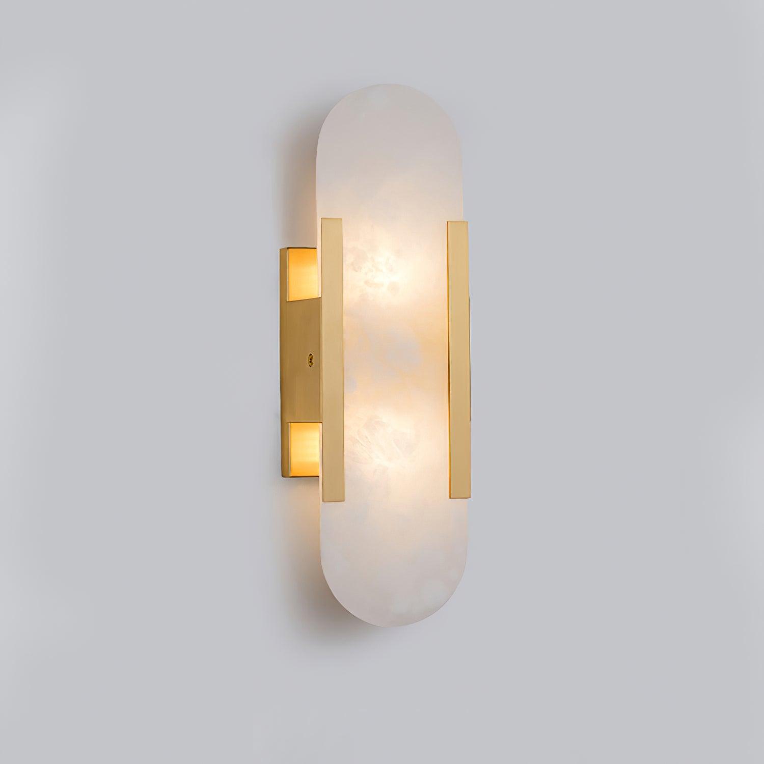 Clérachic brass Olraeia sconce viewed from the side, showing the shallow depth the stone panel sits off the wall