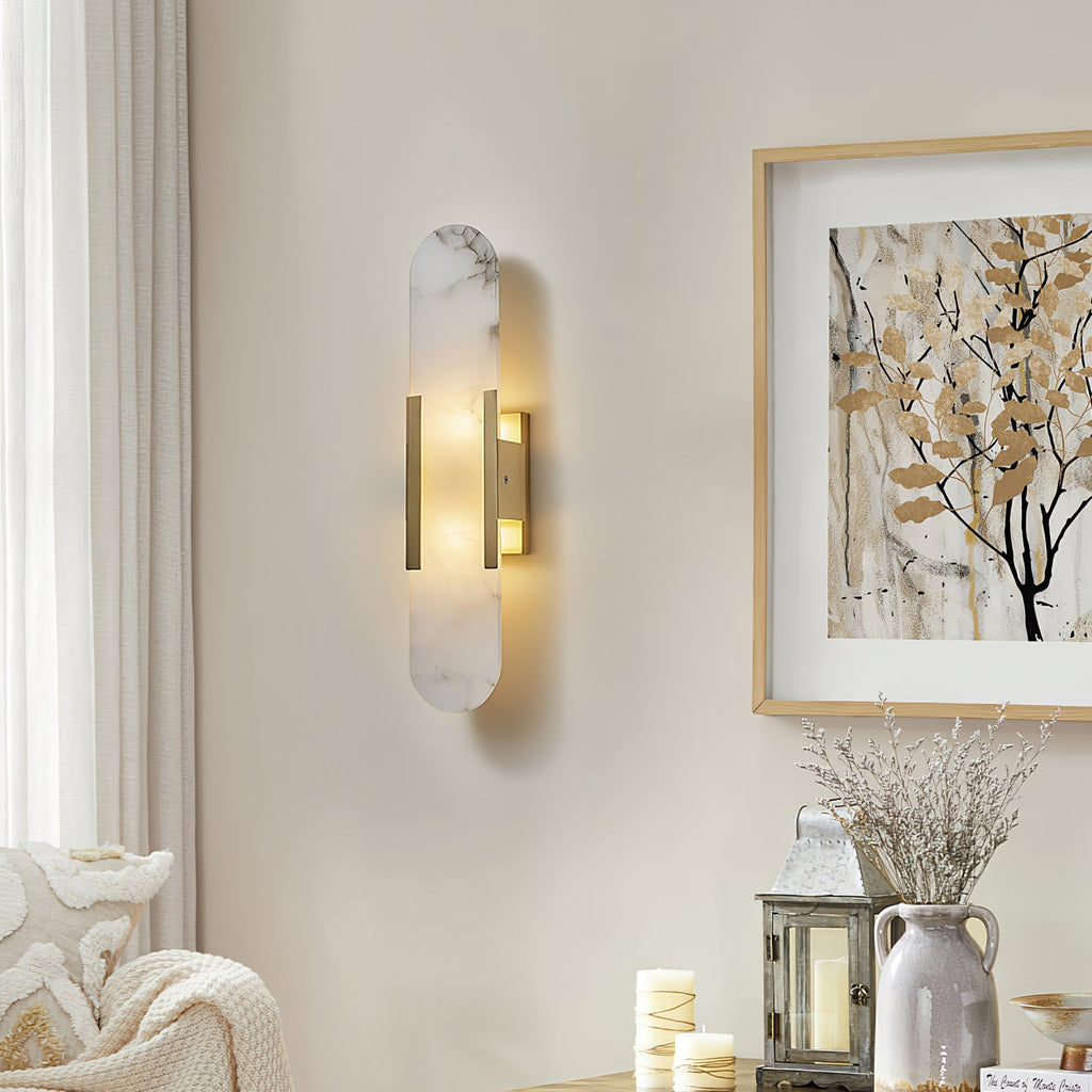 Elongated alabaster sconce with warm glow and stone veining