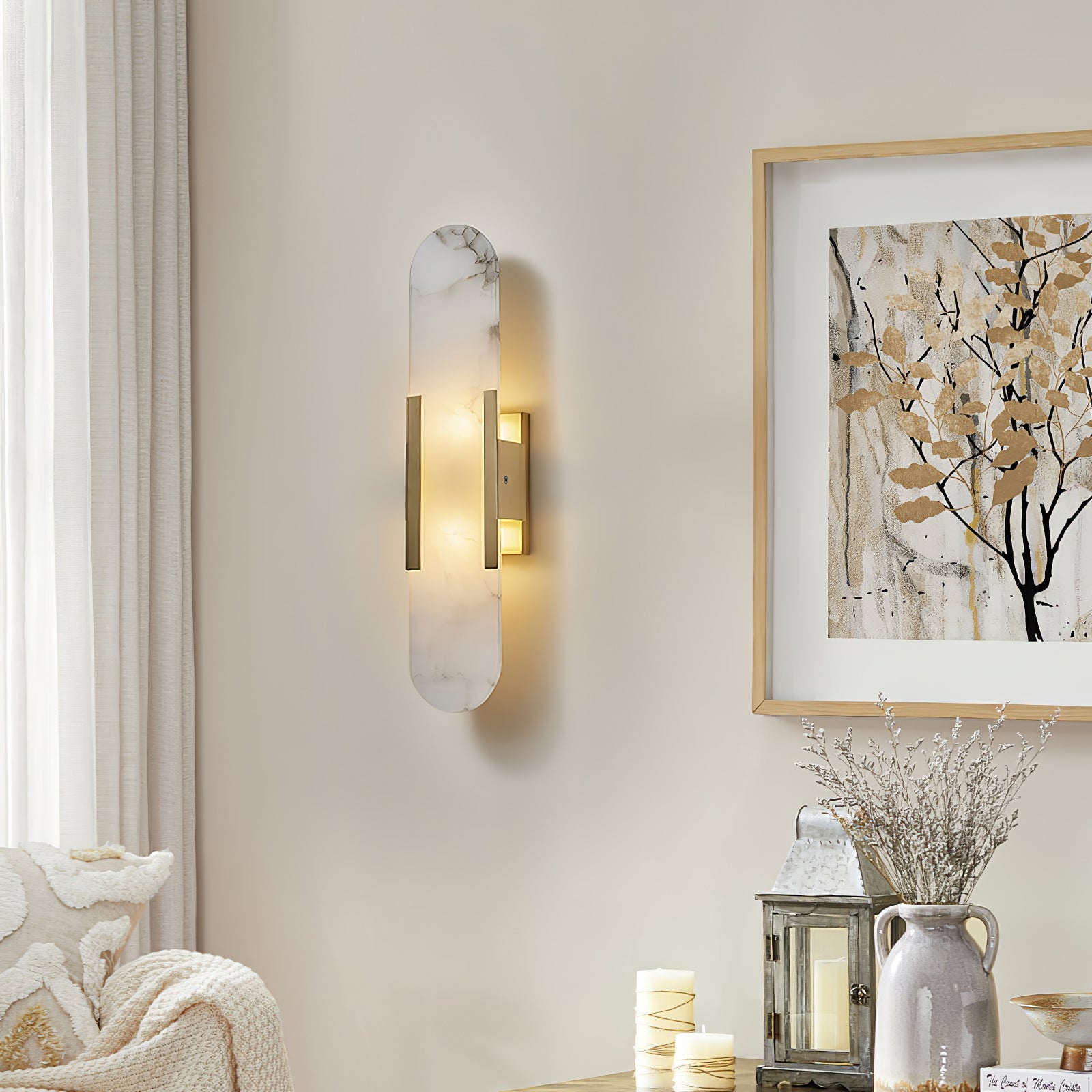 Elongated alabaster sconce with warm glow and stone veining