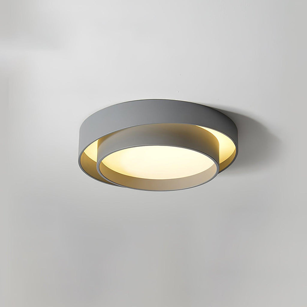 White cylinder ceiling light with warm even glow