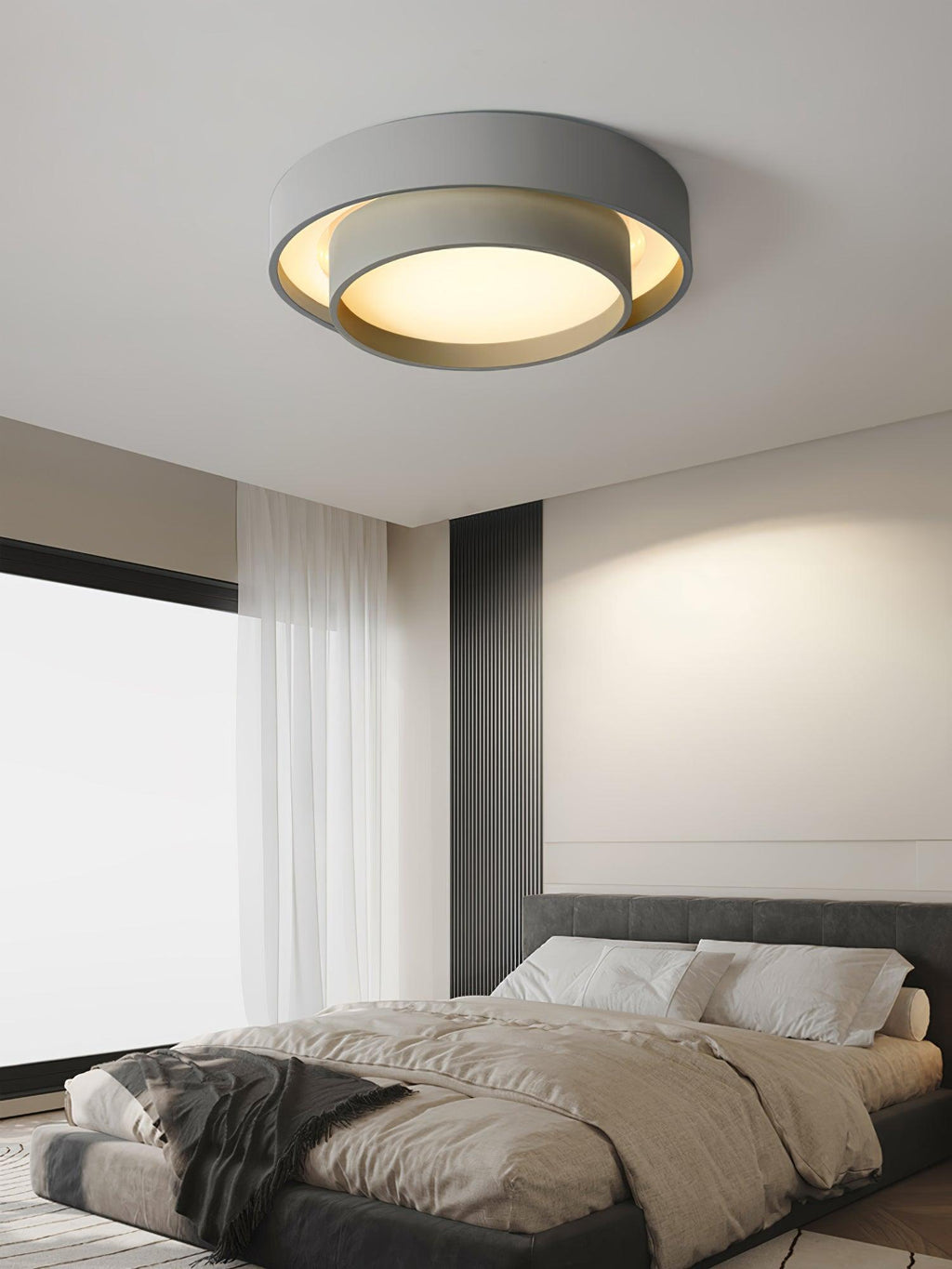 Cylinder ceiling light glowing softly in a styled space