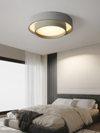 Cylinder ceiling light glowing softly in a styled space