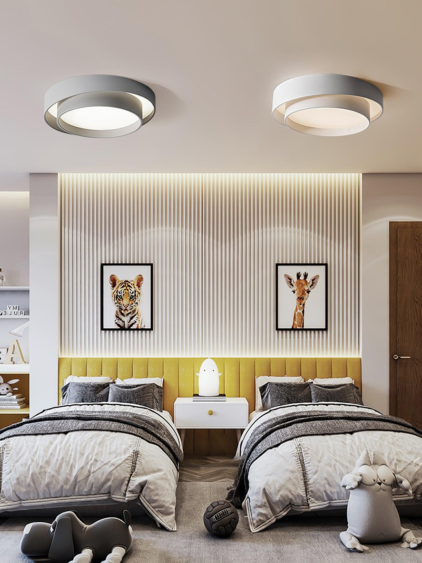 Black cylinder ceiling light with even warm glow