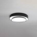 Cylinder ceiling light glowing softly in a modern room