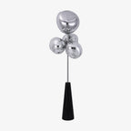 A compact, unlit product shot of this Clérachic floor lamp in mirror-chrome, its globes and black conical base set on a plain light backdrop.