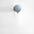 Frosted gray balloon wall sconce with hanging pull cord
