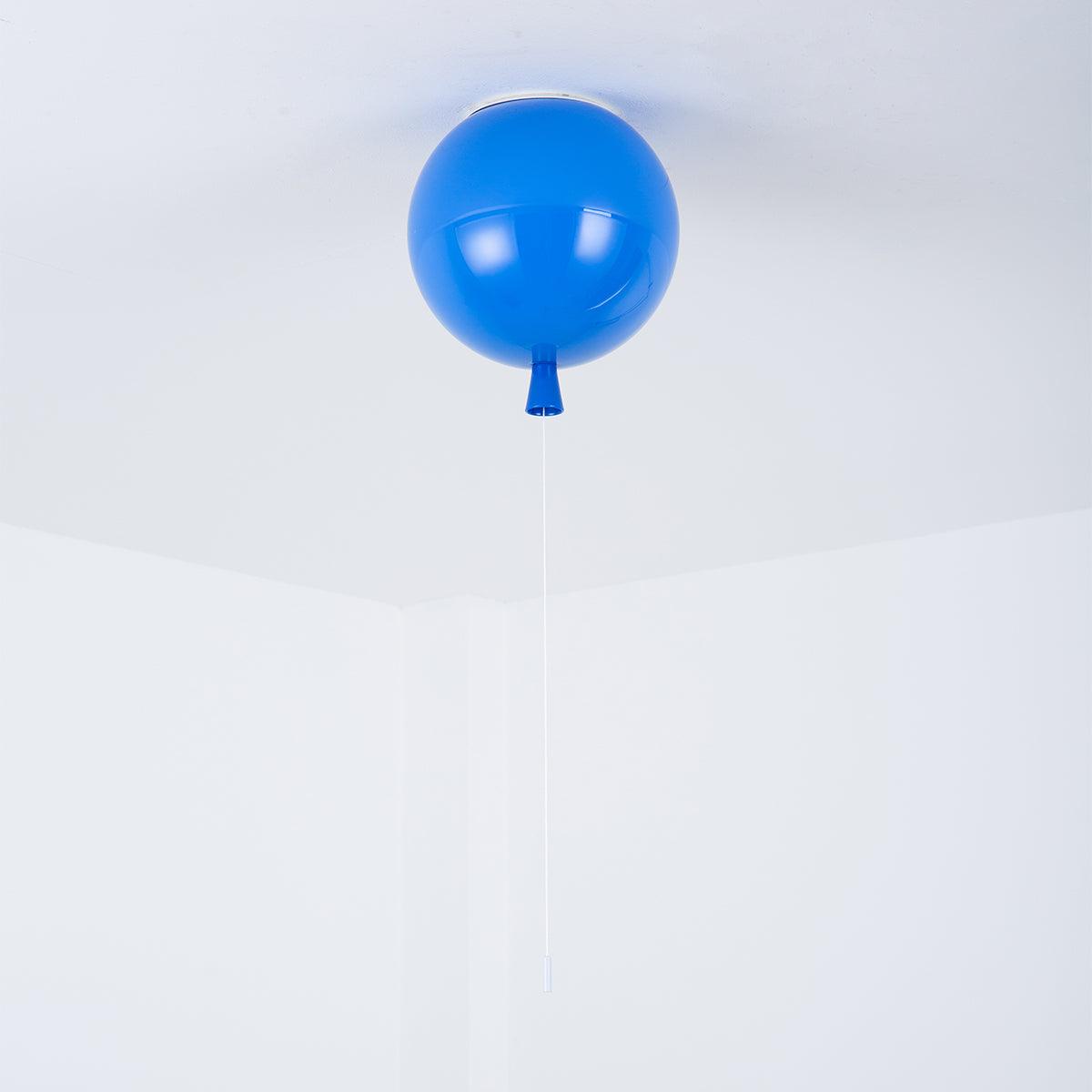 A single blue Clérachic balloon light hangs from a plain white ceiling corner in a straightforward product shot.