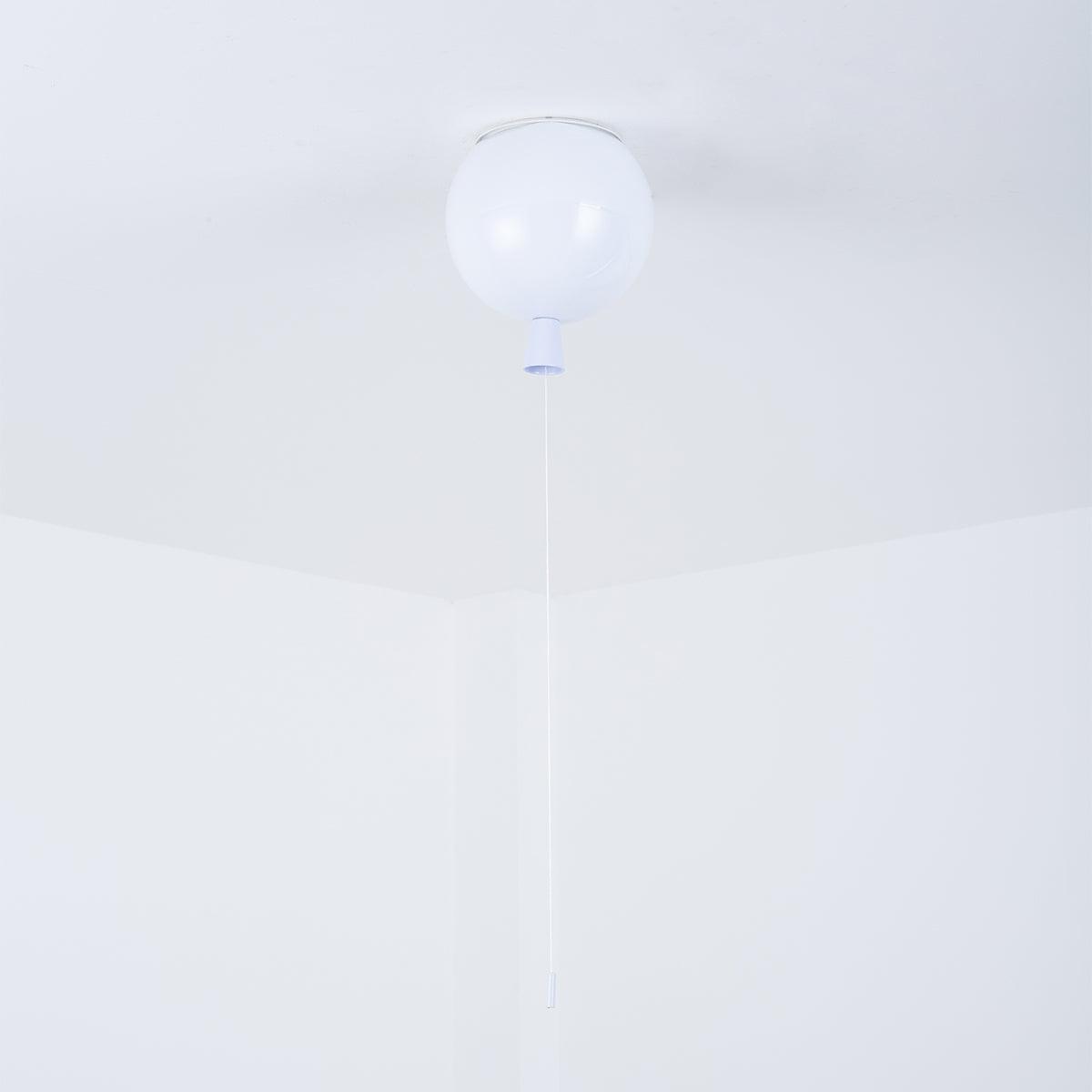 A single white Clérachic balloon light hangs from a plain ceiling corner, its thin pull cord barely visible.