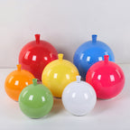 Balloon-shaped glass ornaments in red, blue, orange, yellow, pink, green and white sit together, resembling the shades of this Clérachic ceiling light.