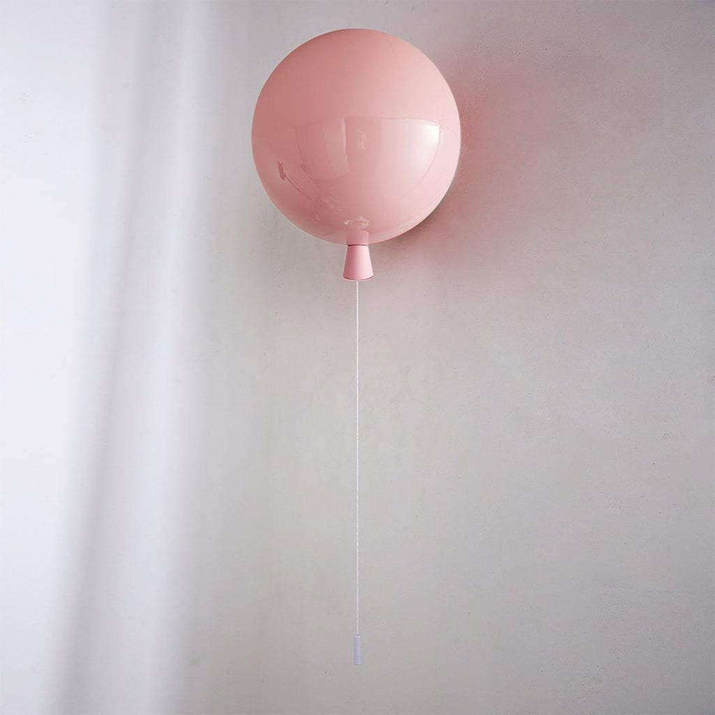 Sculptural balloon wall sconce with a dangling pull cord