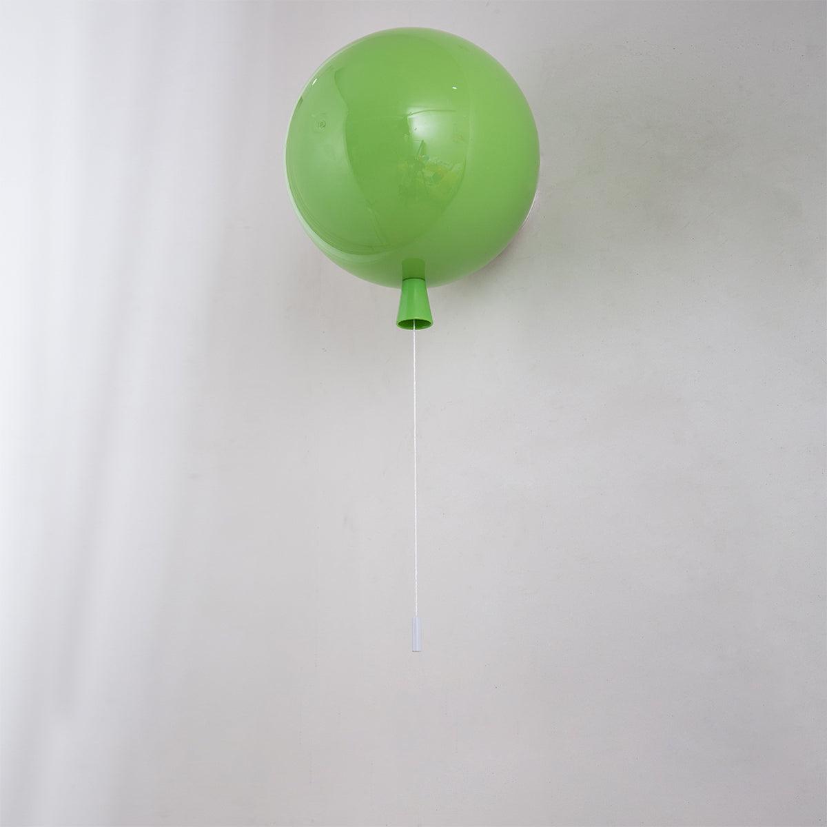 Balloon-shaped wall light glowing in a playful interior