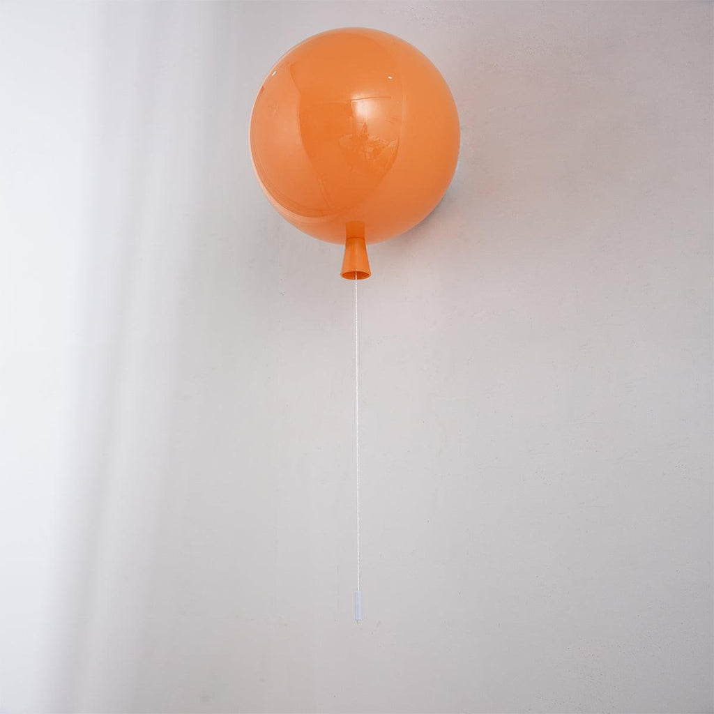 Balloon wall light casting a soft atmospheric glow