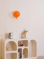 Balloon wall light glowing softly in a child's bedroom