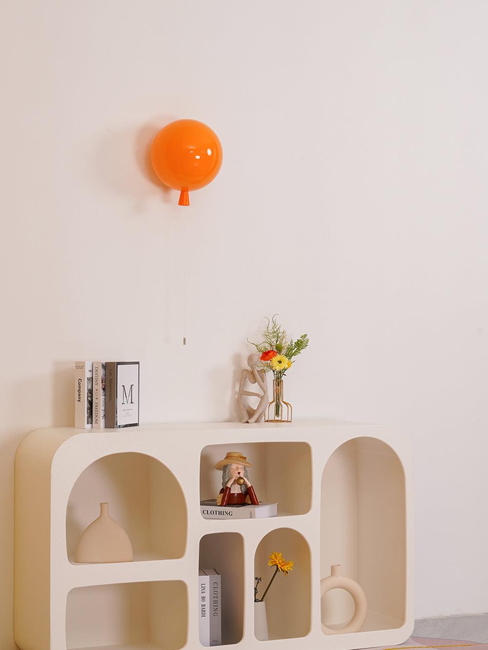 Balloon wall light glowing softly in a child's bedroom