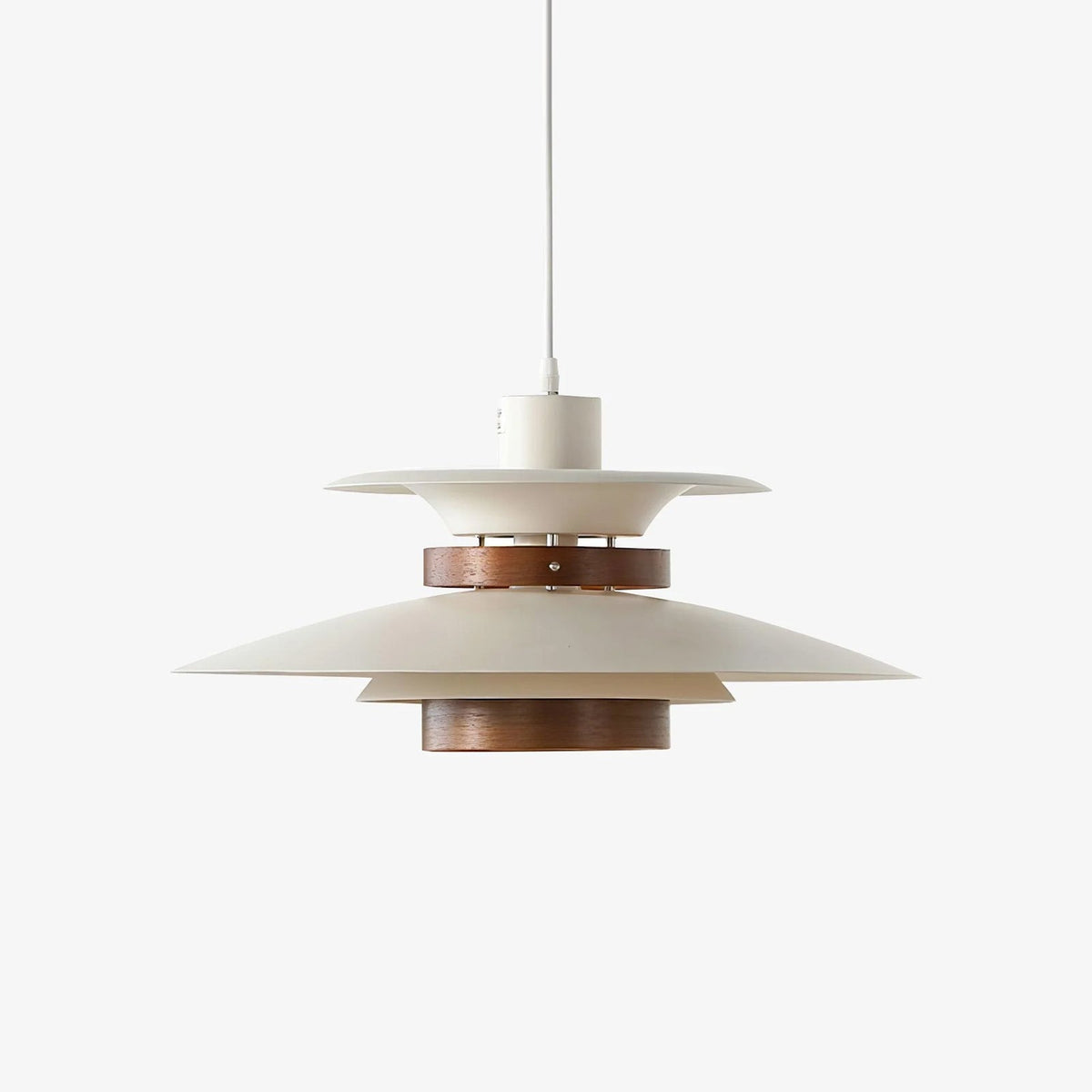 Angled view of the white shades and walnut ring on this unlit Clérachic pendant.