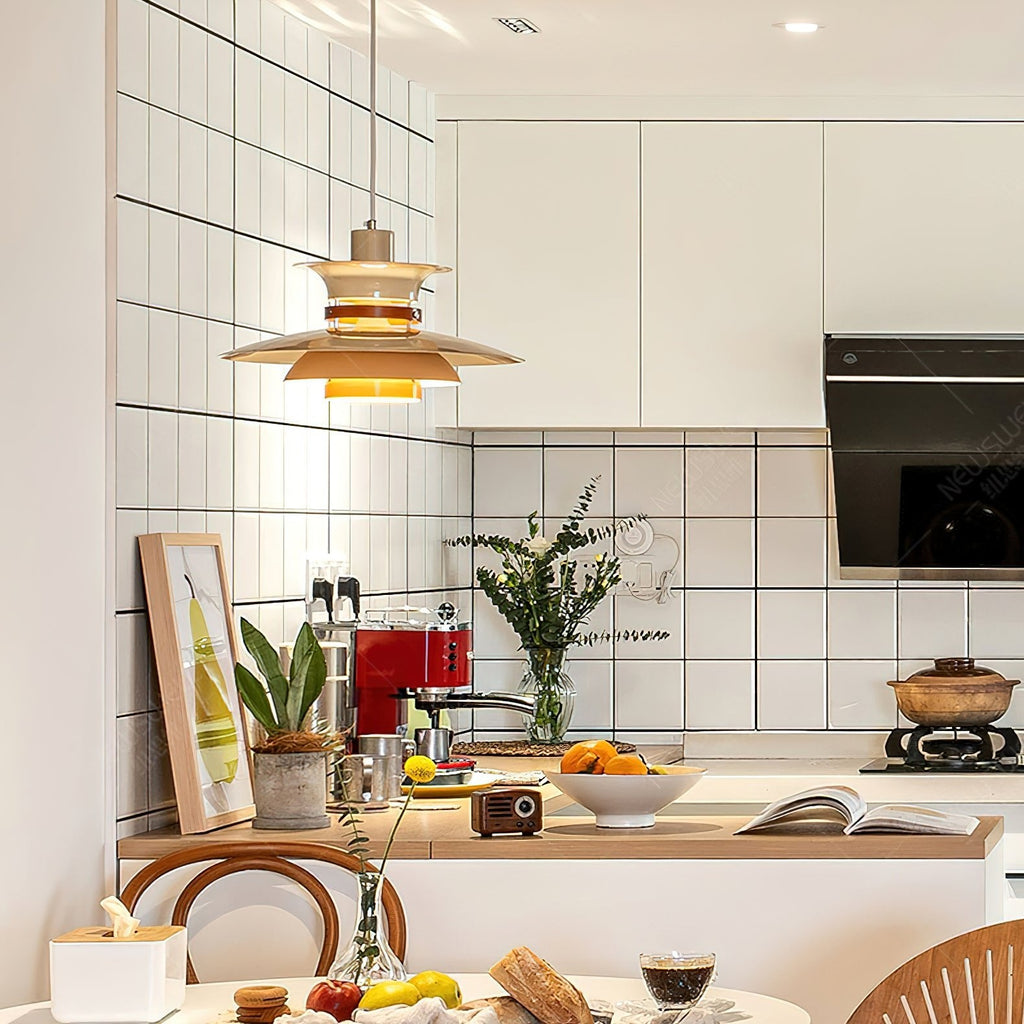 A beige Clérachic pendant hangs in a white tiled kitchen with fresh herbs on the counter.