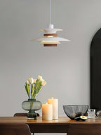 A white Clérachic pendant hangs above a table set with tulips and pillar candles.