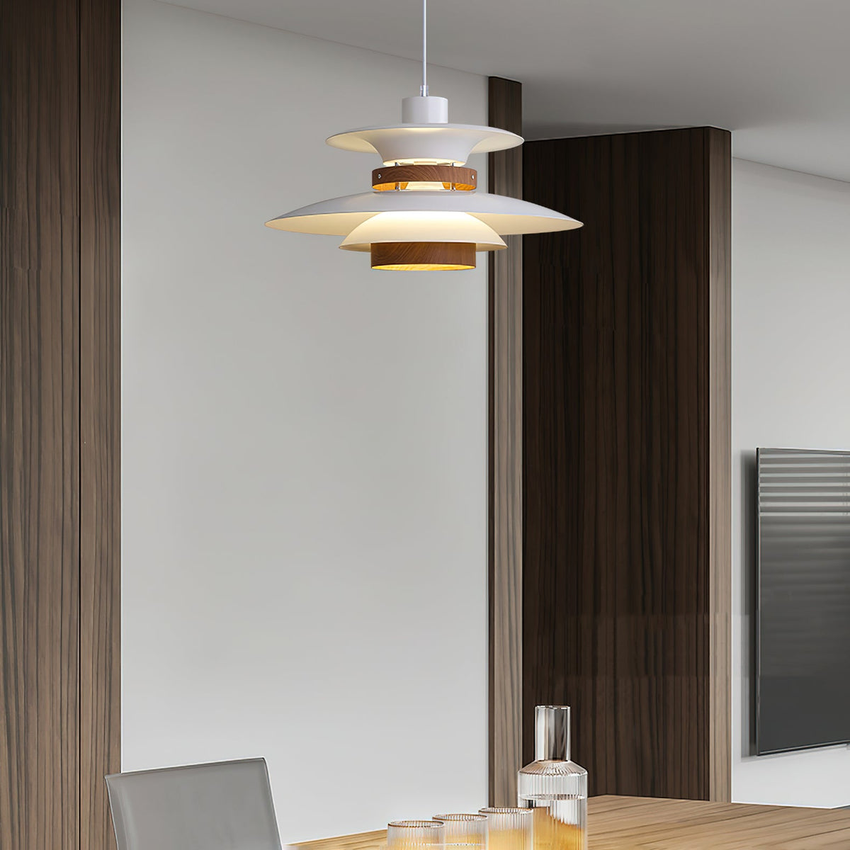 A white Clérachic pendant hangs against dark wood kitchen cabinetry.