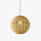 This Clérachic pendant's hemp rope sphere glows warm, shown alone against a plain off-white backdrop.
