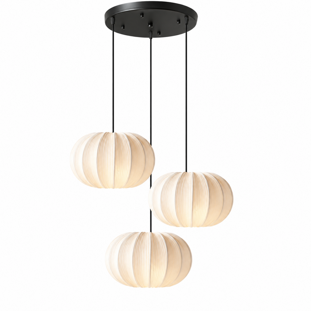 This three-head Clérachic pendant clusters three round pleated shades at staggered heights from a black canopy.
