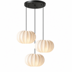 This three-head Clérachic pendant clusters three round pleated shades at staggered heights from a black canopy.
