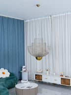Wirework pendant light shown lit in a styled setting