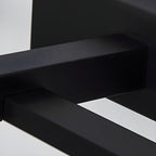 Black linear wall light shown lit in a bathroom