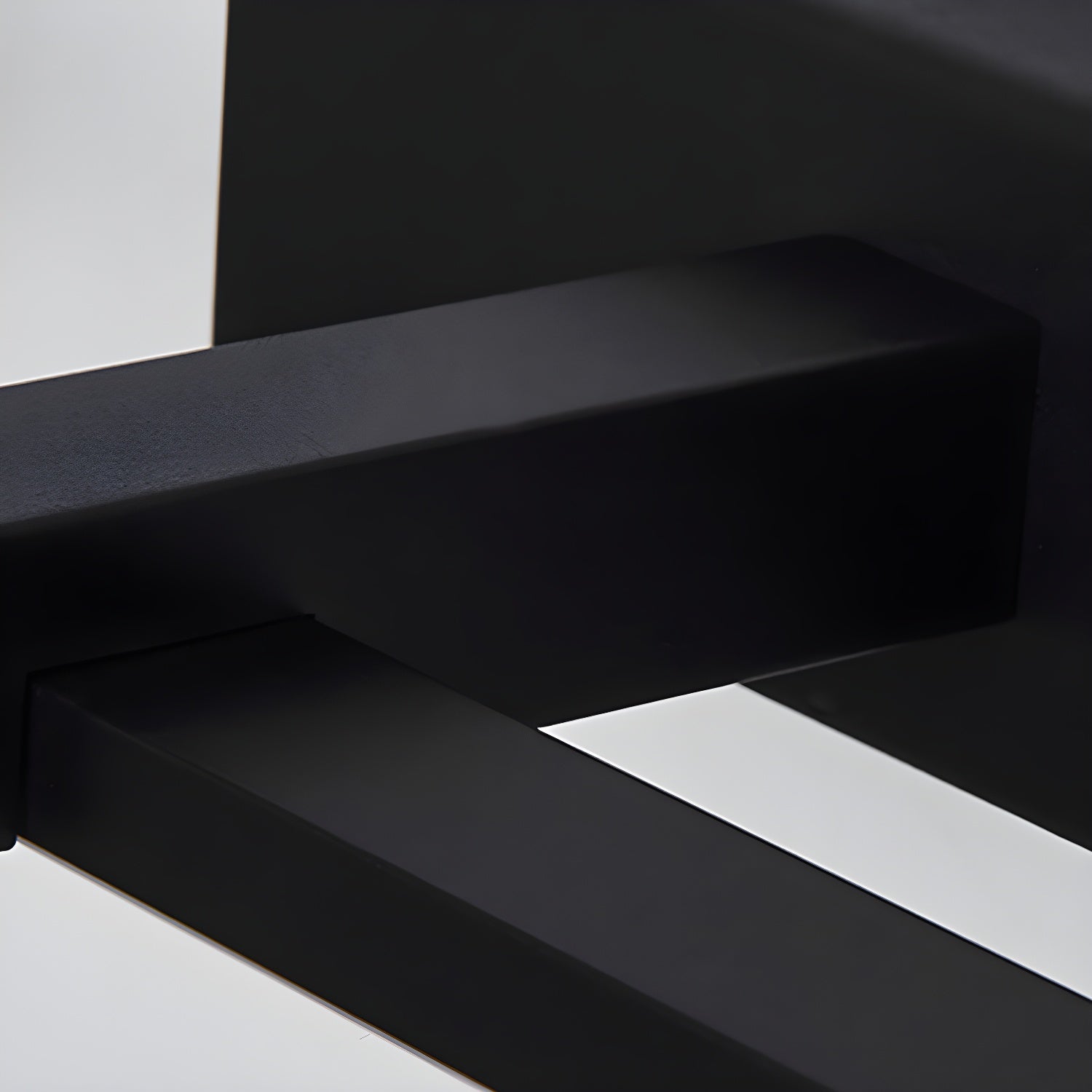 Black linear wall light shown lit in a bathroom