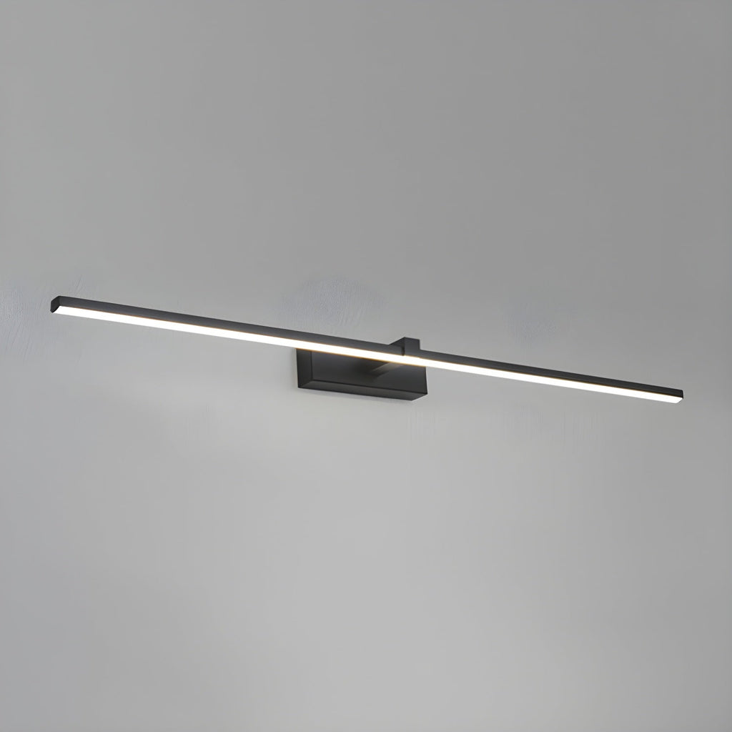 Slim black linear wall light mounted near a mirror