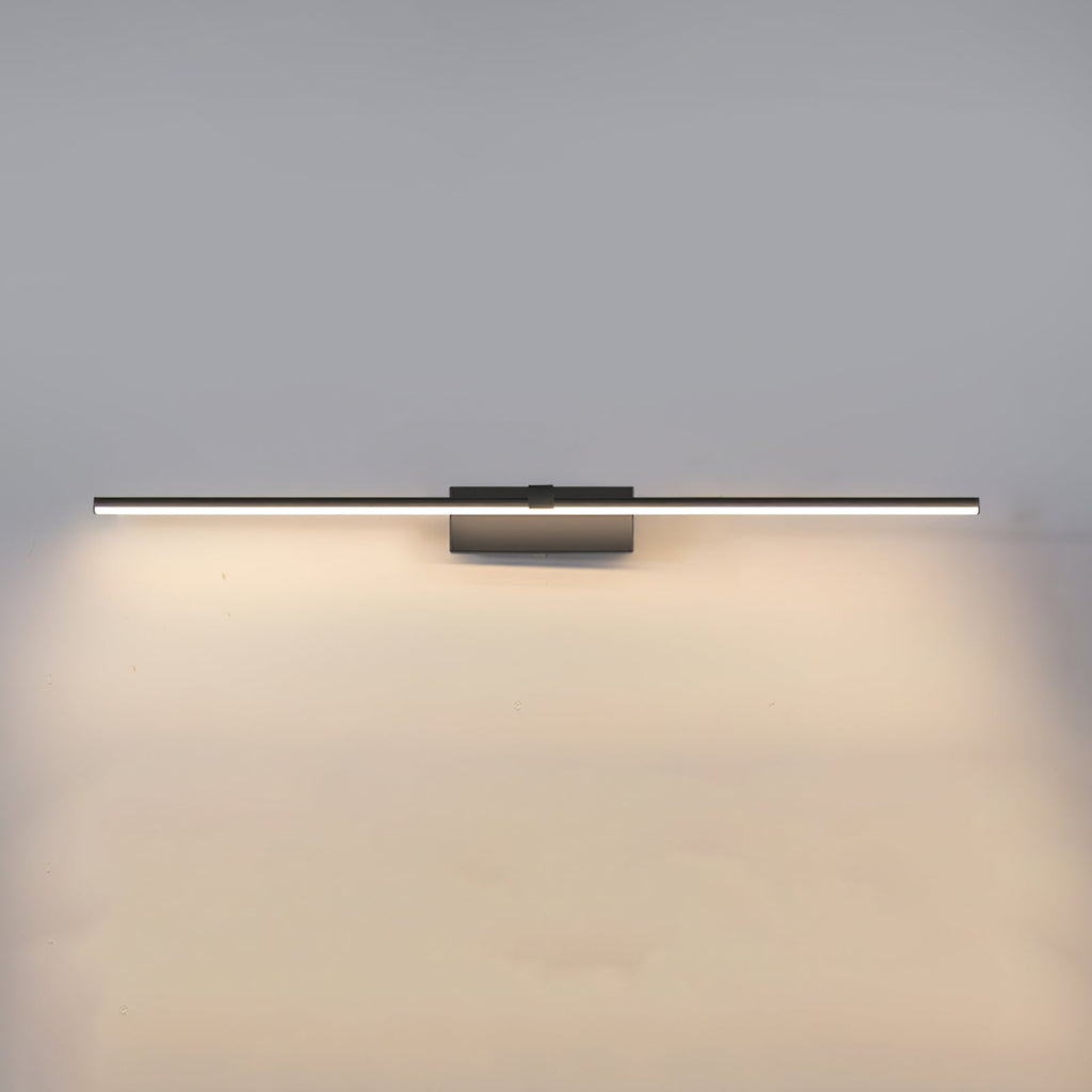 Black metal bar wall light casting even light on a wall