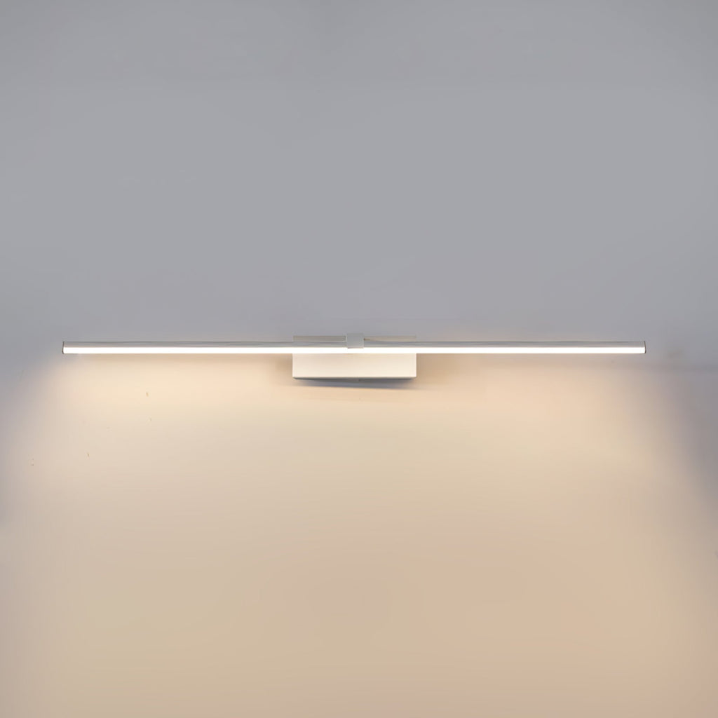 Slim bar wall light framing a vanity mirror
