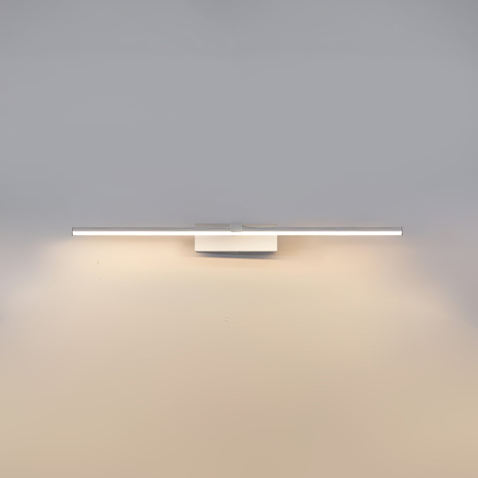 Slim linear wall light shown lit in a modern bathroom