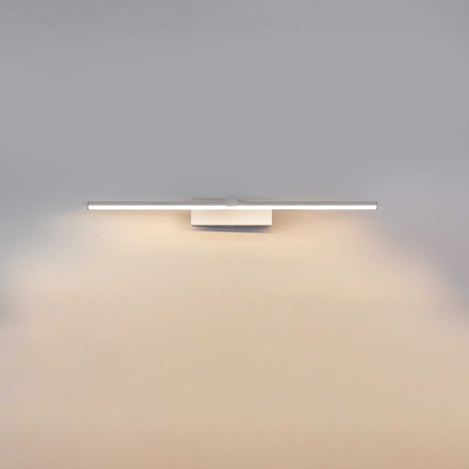 Linear LED wall light mounted above a vanity area