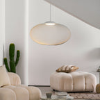 Iron lattice pendant light glowing in a cozy room