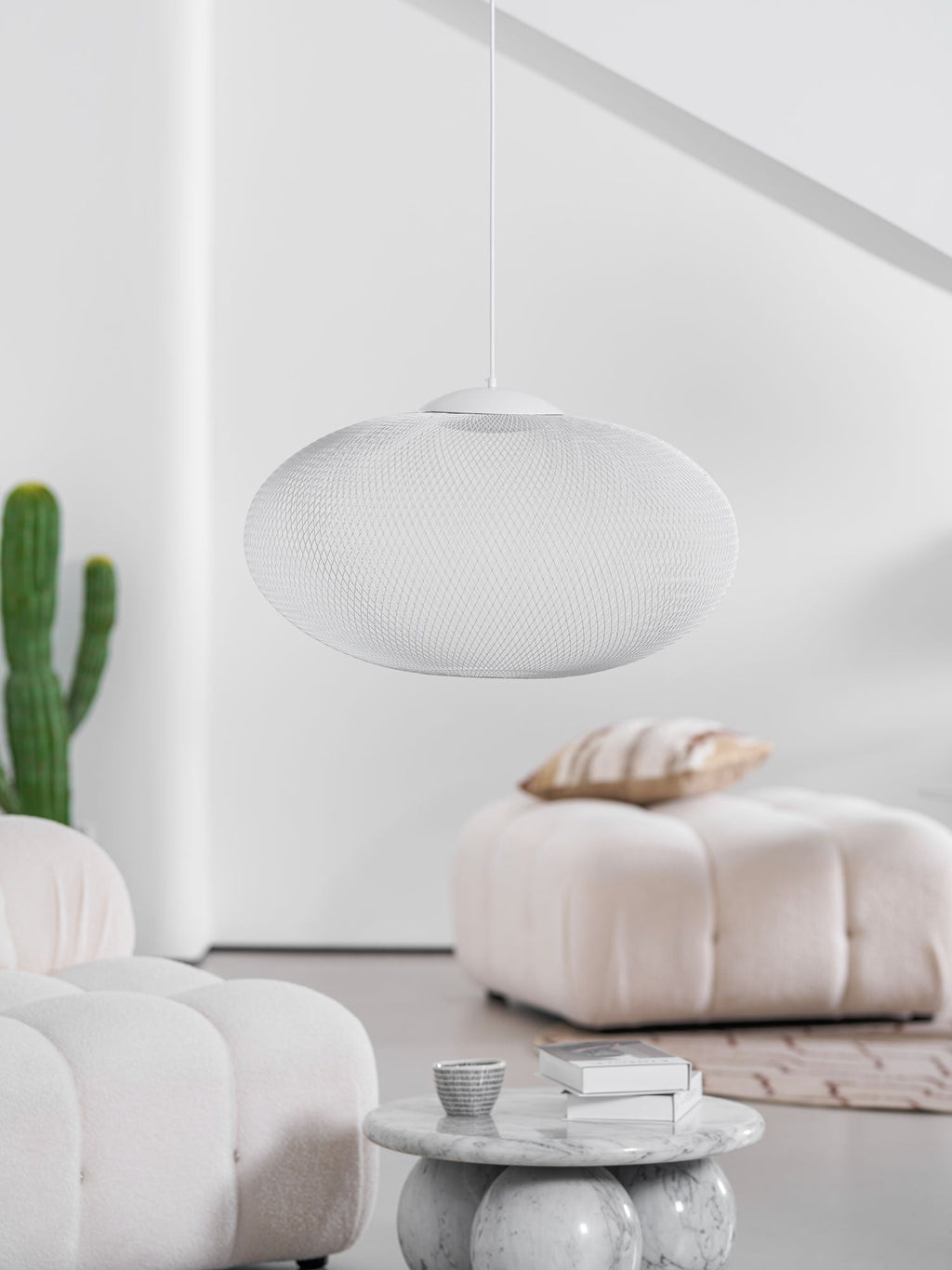 Black lattice pendant light glowing softly indoors