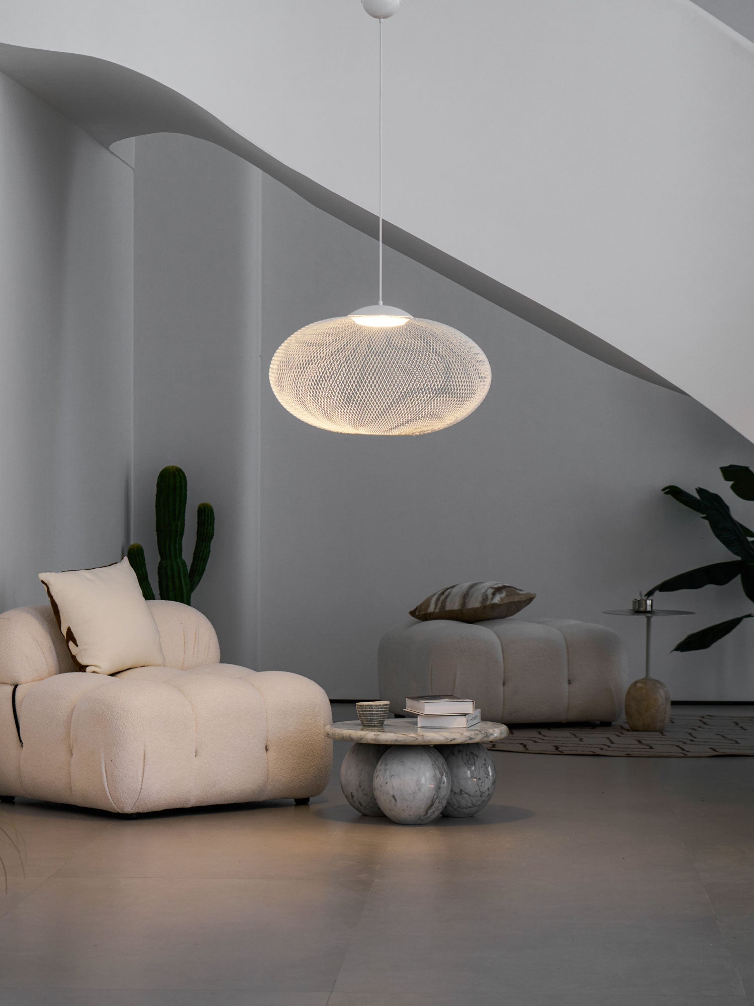 Iron mesh pendant light casting patterned shadows