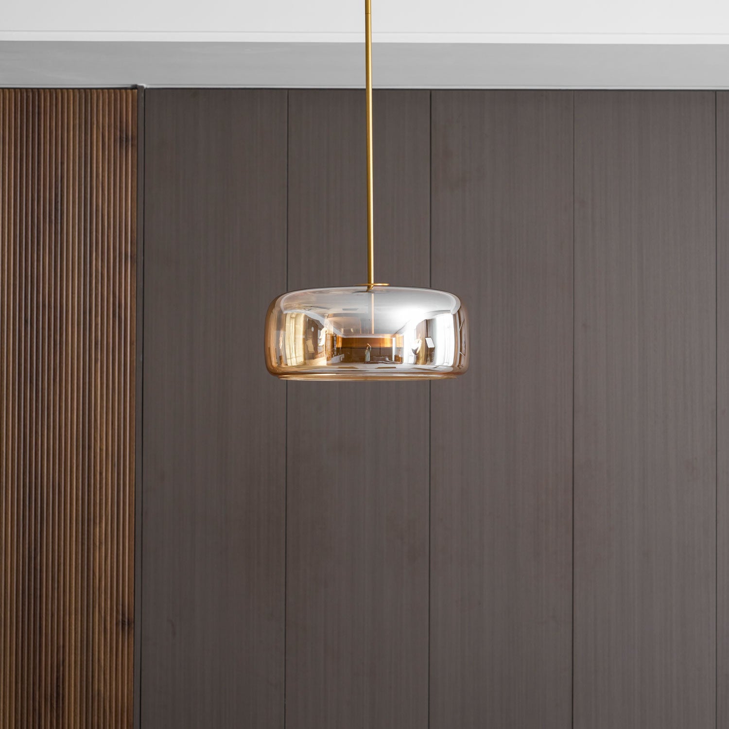 Glass globe pendant light with warm LED in a loft setting