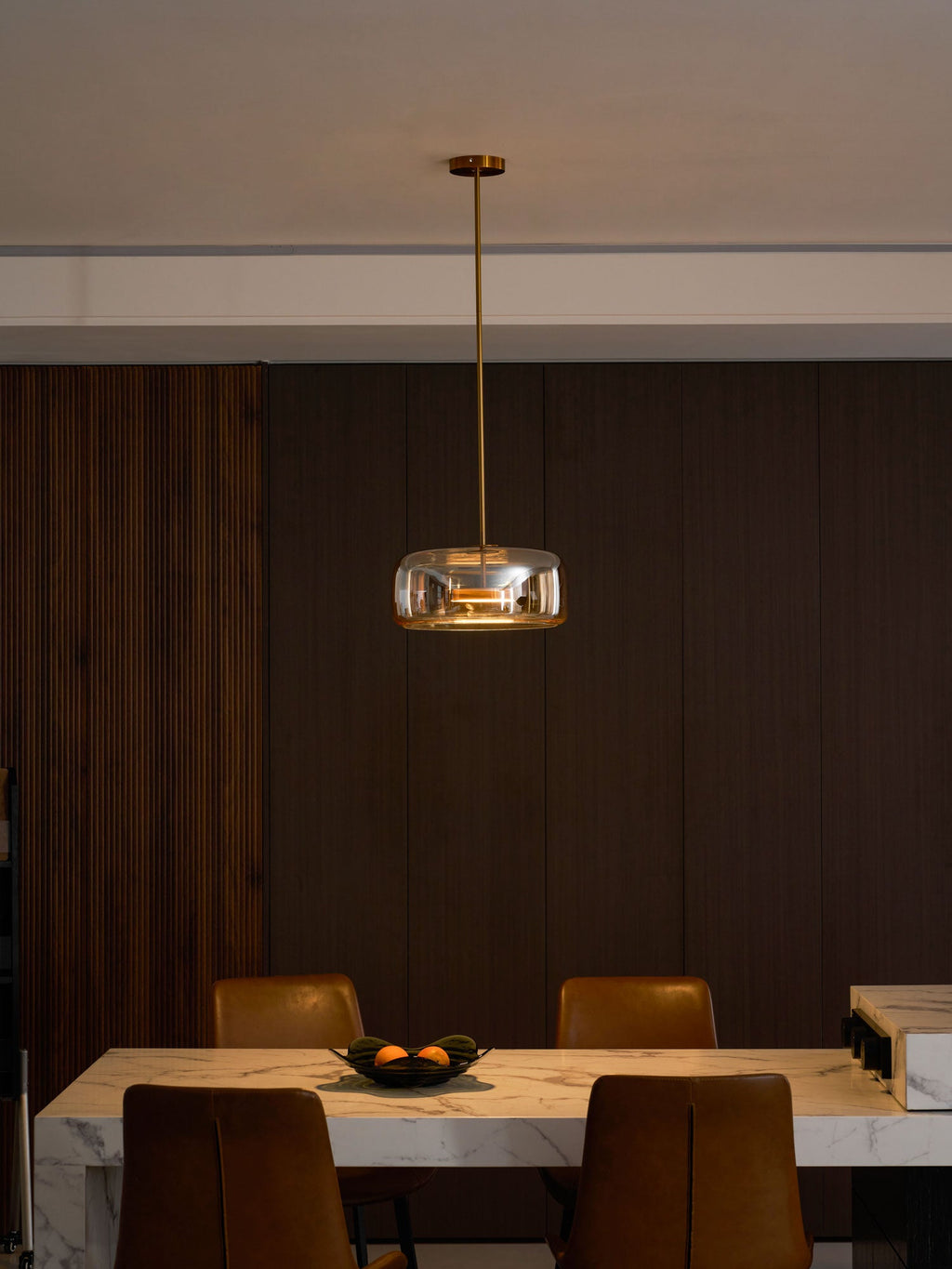 Round glass pendant light detail with metal canopy plate