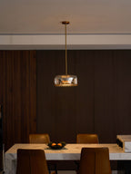 Round glass pendant light detail with metal canopy plate