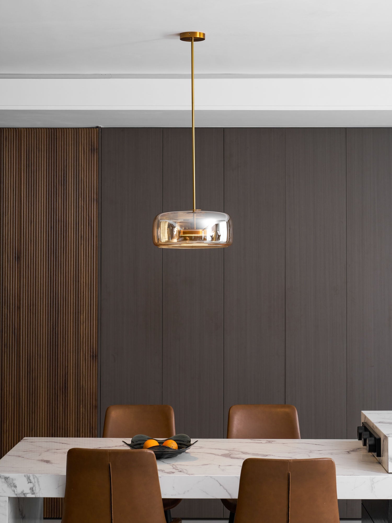 Glass globe pendant light styled in a contemporary room