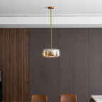 Hand-blown glass pendant light hanging in a bright interior