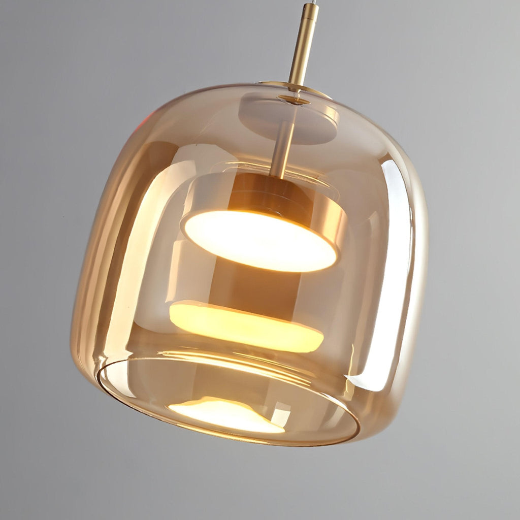 Smoked glass pendant light close-up showing warm glow