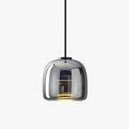 Glass globe pendant light shown against a clean neutral backdrop