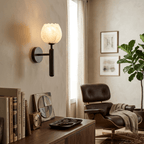 Mian wall lamp carved stone petals lit with a calm glow