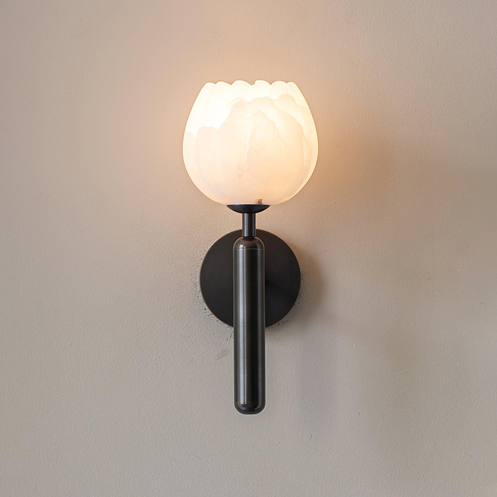 Mian wall lamp alabaster flower shade glowing with warm light