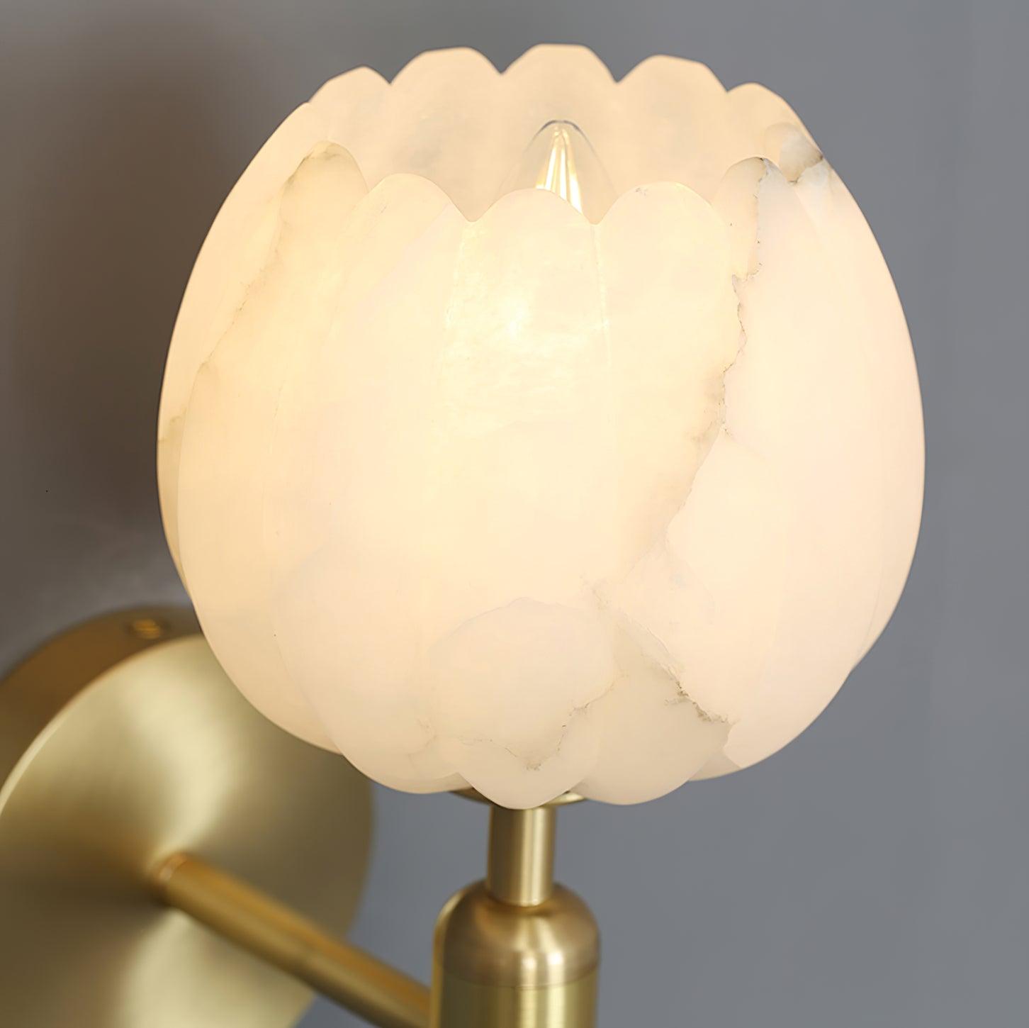 Macro view of the alabaster shade lit from inside, with the brass socket collar visible below