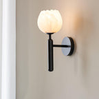 Mian wall lamp carved stone shade with a gentle warm glow
