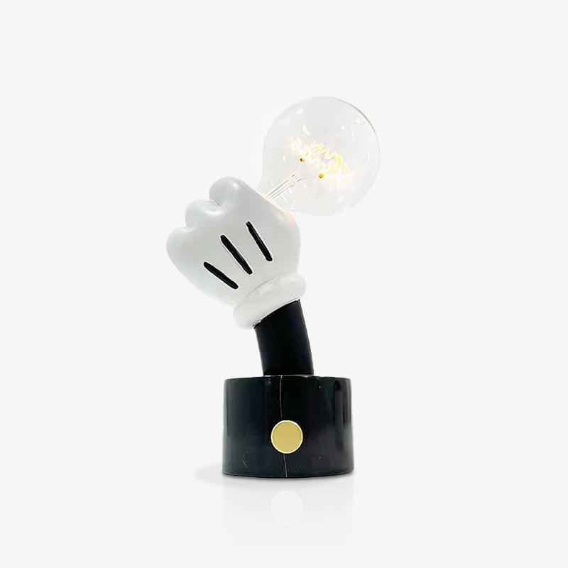 Set against plain grey, this Clérachic novelty table lamp's clear bulb sits only faintly lit above its black marble base.