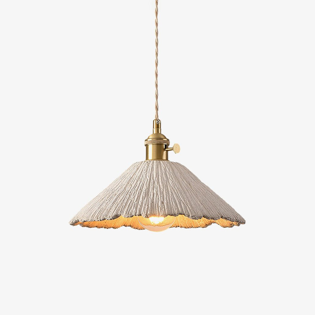 Cement pendant light with warm light pooling below