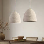 Microcement pendant light hanging in a minimal space
